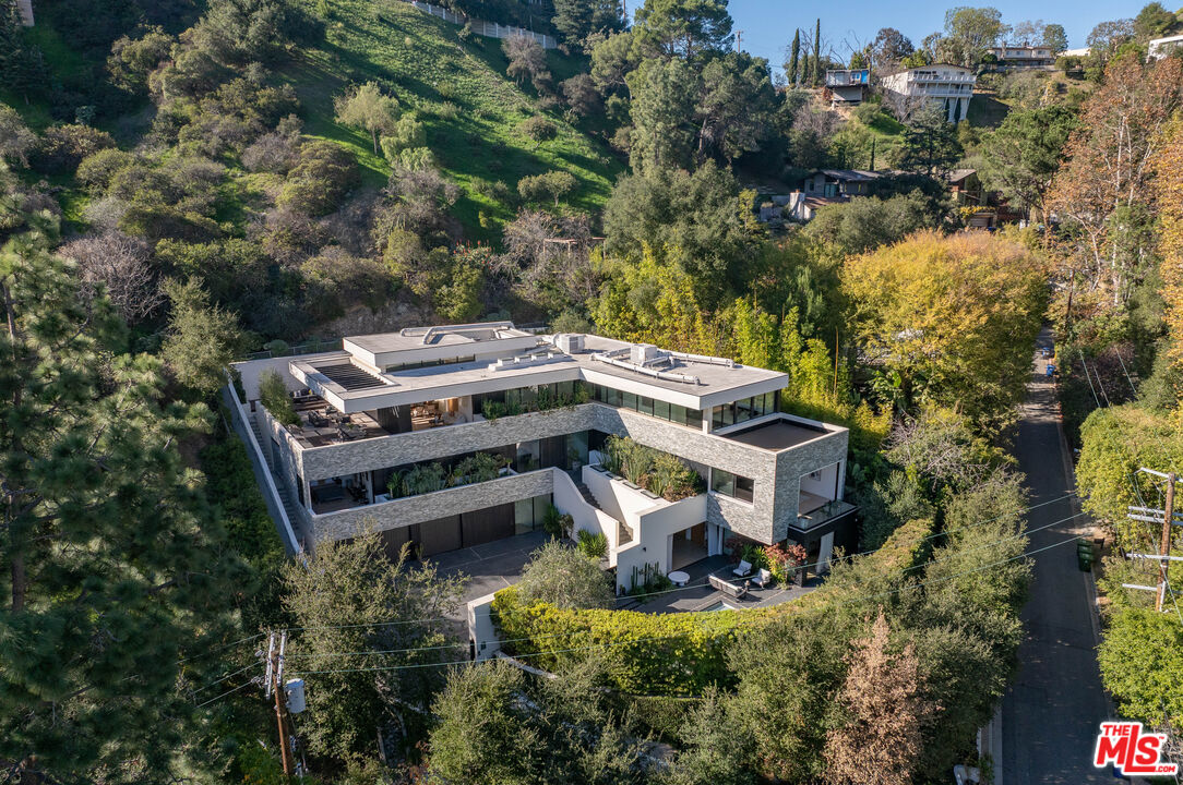 7681 Willow Glen Road Los Angeles, CA 90046 - Photo 5 of 71 an aerial view of a house with a yard