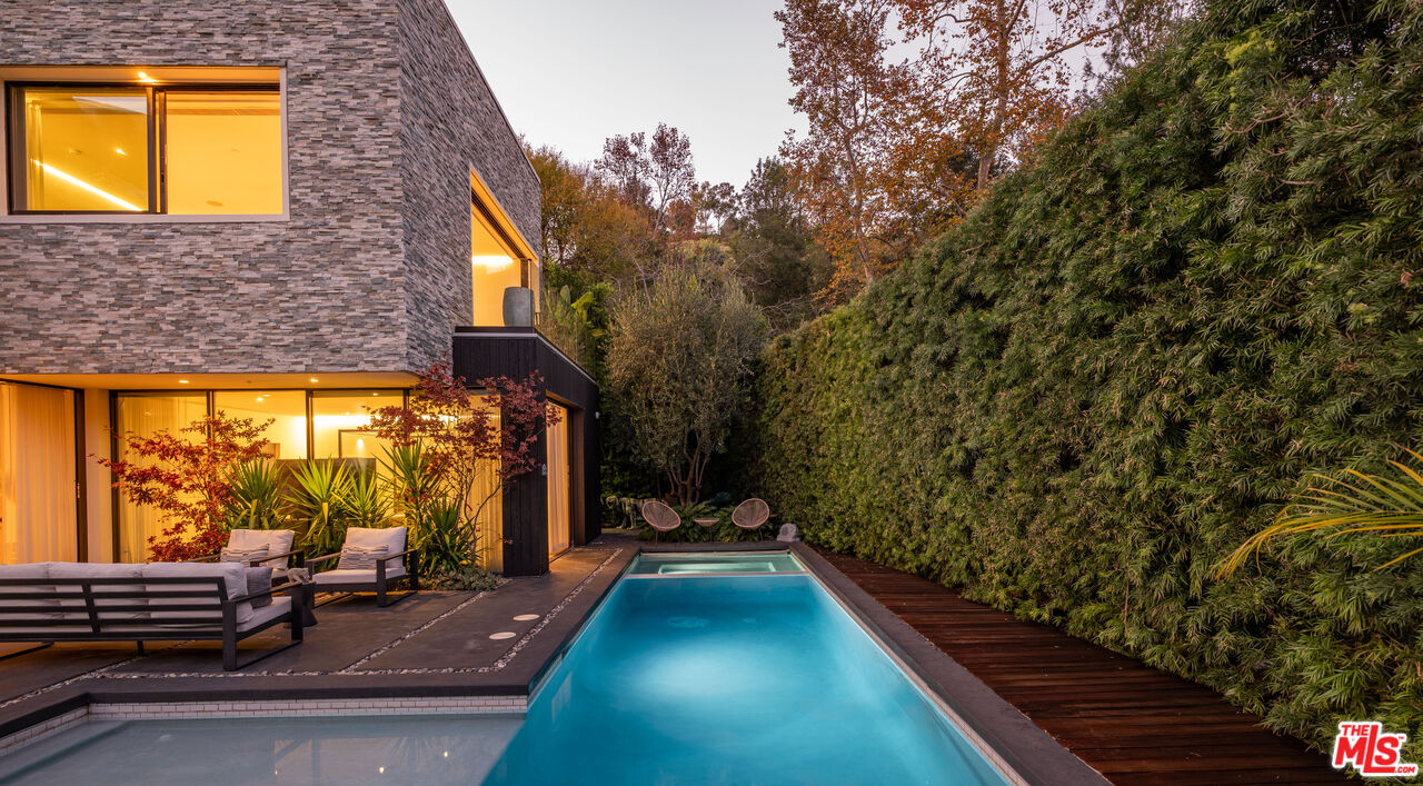 7681 Willow Glen Road Los Angeles, CA 90046 - Photo 56 of 71 a view of swimming pool with outdoor seating
