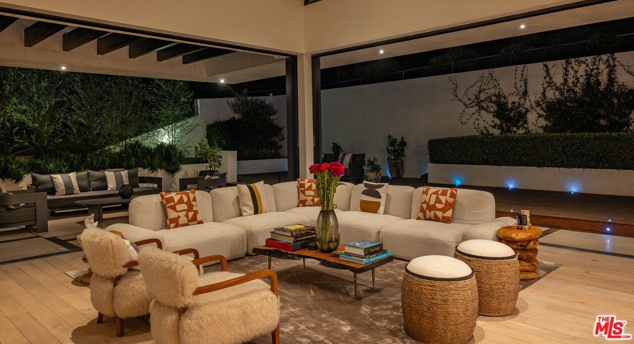 7681 Willow Glen Road Los Angeles, CA 90046 - Photo 59 of 71 a living room with furniture and a flat screen tv
