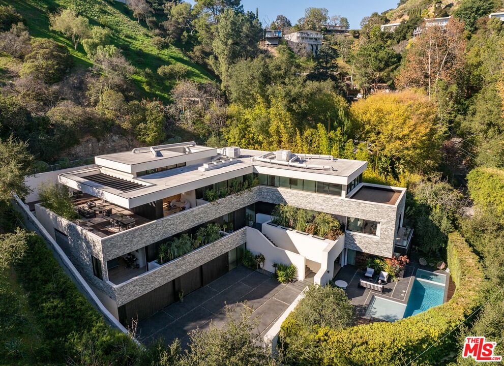 7681 Willow Glen Road Los Angeles, CA 90046 - Photo 6 of 71 an aerial view of a house with a yard patio and fire pit