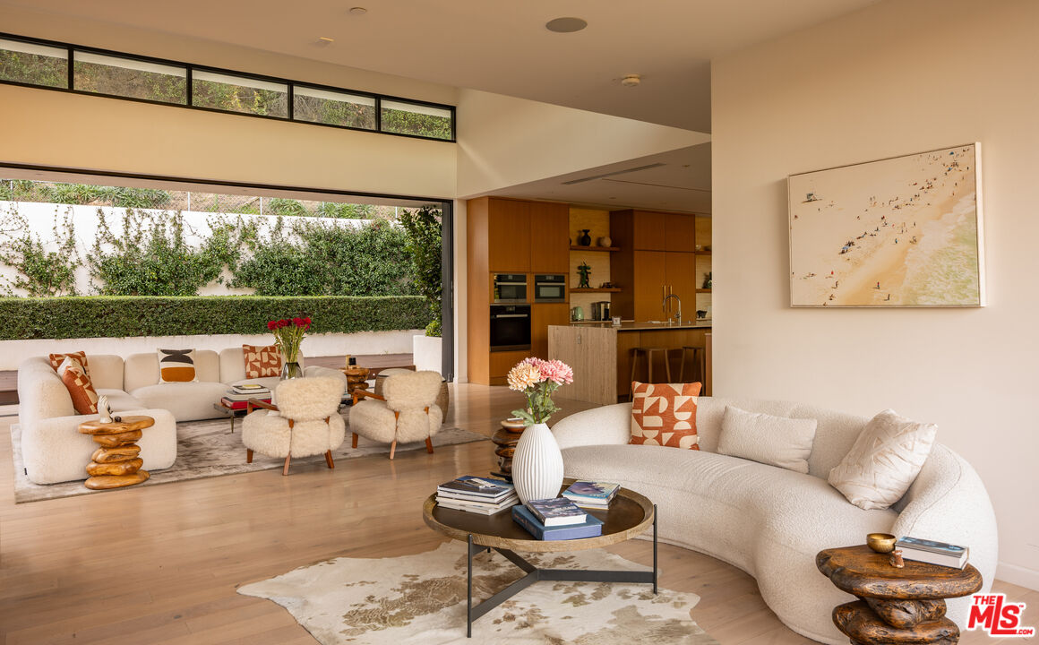 7681 Willow Glen Road Los Angeles, CA 90046 - Photo 9 of 71 a living room with furniture and a large window