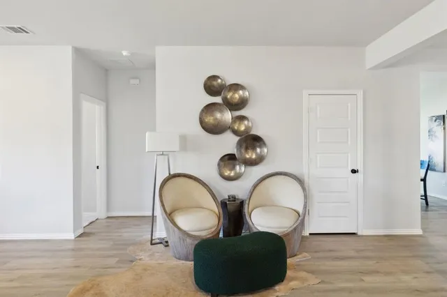 a view of a bathroom with toilet and a mirror