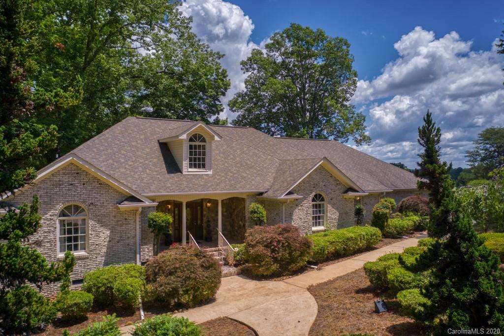 77 Club Road Tryon, NC 28782 - Photo 2 of 35 a front view of house with yard and green space