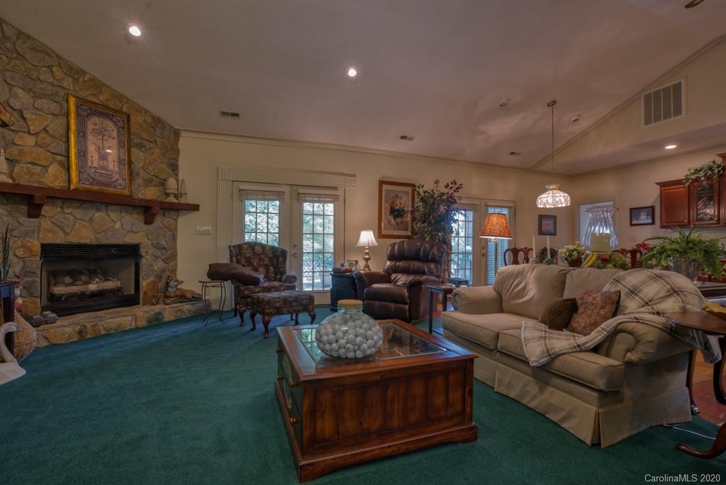 77 Club Road Tryon, NC 28782 - Photo 11 of 35 a living room with furniture and a fireplace