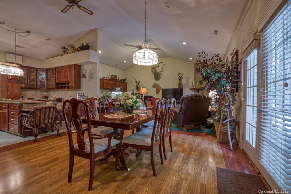 77 Club Road Tryon, NC 28782 - Photo 12 of 35 a view of a dining room with furniture and wooden floor