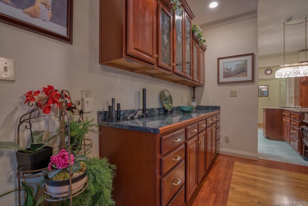 77 Club Road Tryon, NC 28782 - Photo 14 of 35 a kitchen with stainless steel appliances granite countertop a sink and cabinets