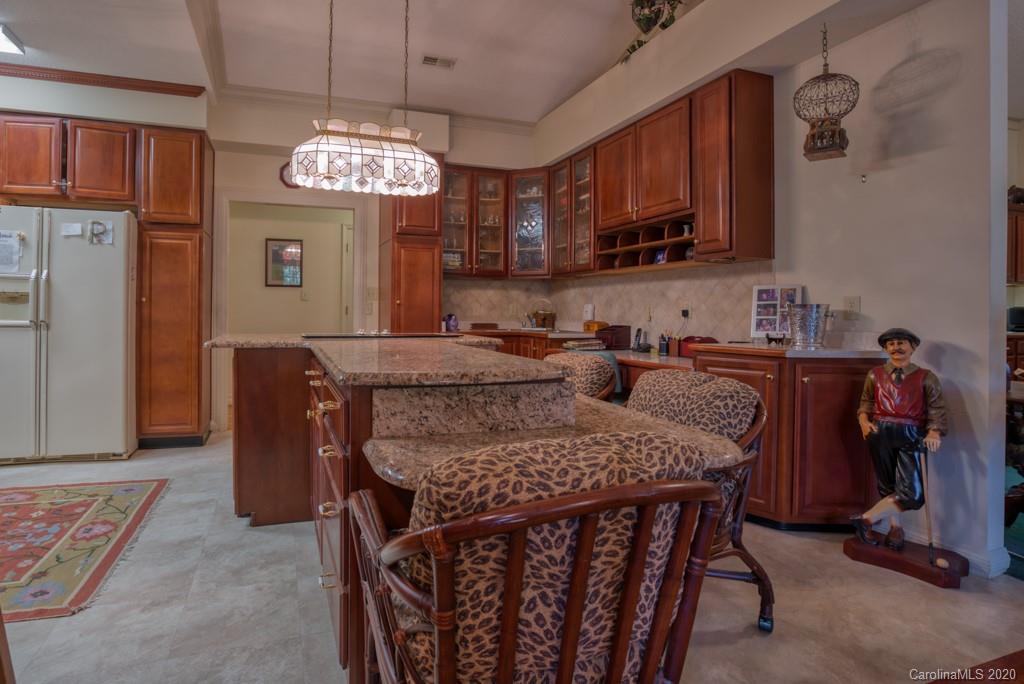 77 Club Road Tryon, NC 28782 - Photo 15 of 35 a view of a dining room with furniture