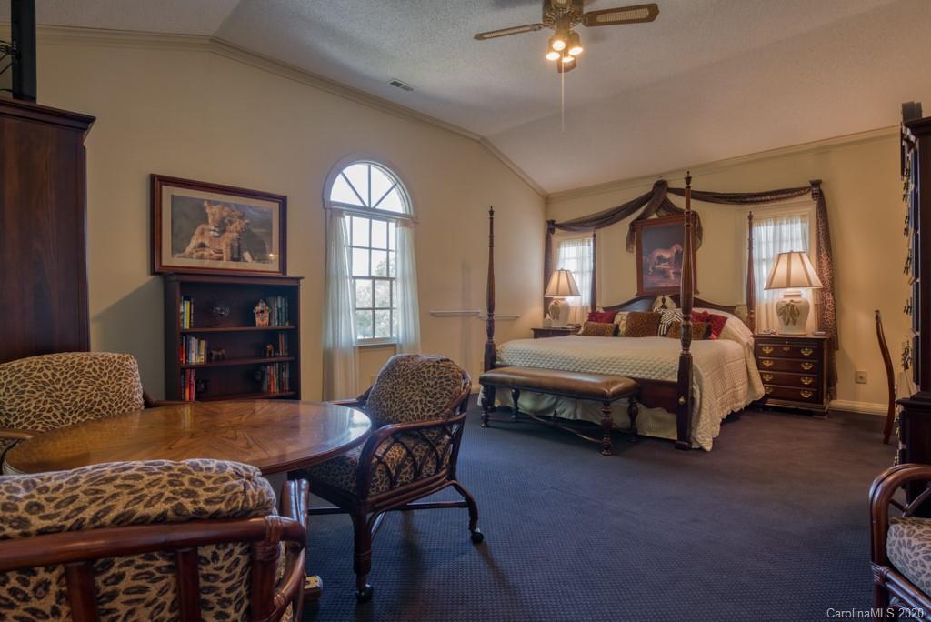 77 Club Road Tryon, NC 28782 - Photo 21 of 35 a bedroom with a bed and dresser