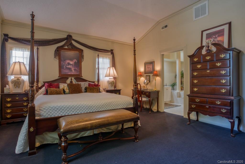 77 Club Road Tryon, NC 28782 - Photo 22 of 35 a bedroom with a bed and furniture