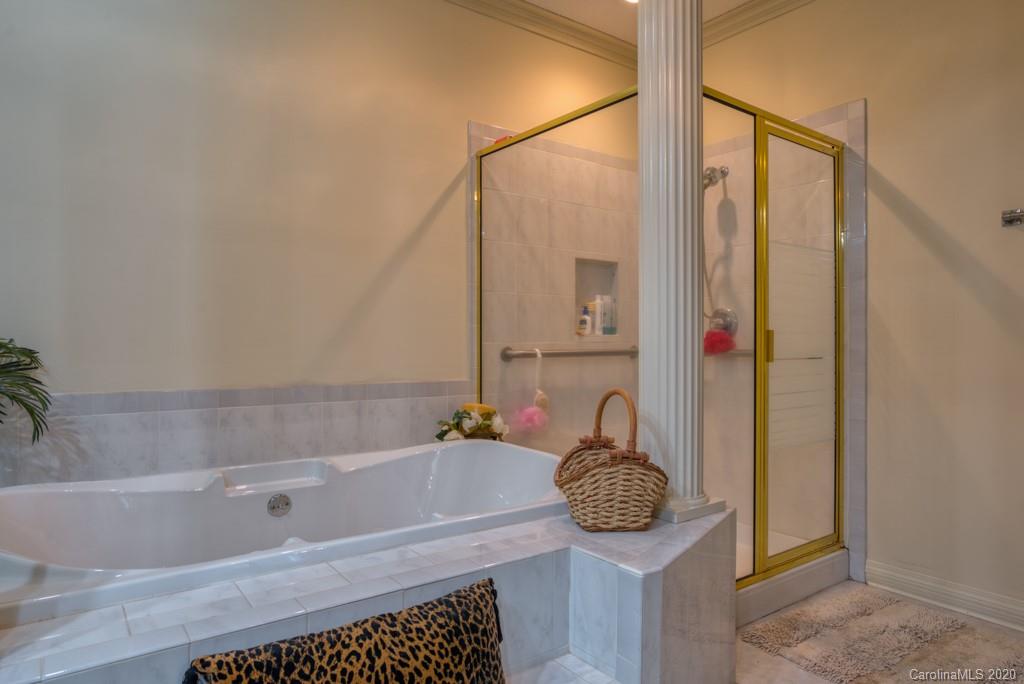 77 Club Road Tryon, NC 28782 - Photo 24 of 35 a bathroom with a bathtub and shower