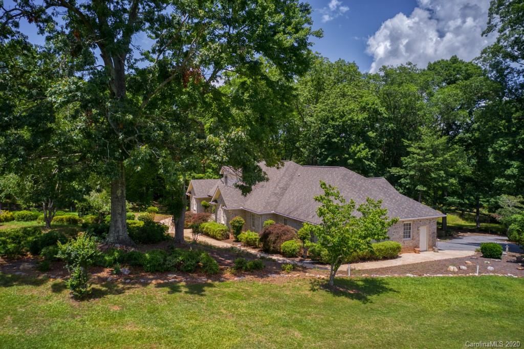 77 Club Road Tryon, NC 28782 - Photo 4 of 35 an aerial view of a house with a yard and large tree