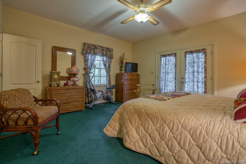 77 Club Road Tryon, NC 28782 - Photo 34 of 35 a bedroom with bed and window
