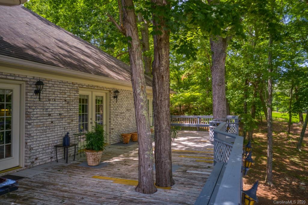 77 Club Road Tryon, NC 28782 - Photo 6 of 35 a view of a house with backyard from a ceiling window