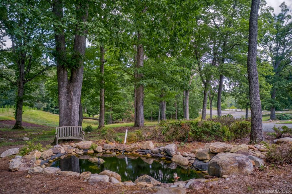 77 Club Road Tryon, NC 28782 - Photo 8 of 35 a front view of a house with garden
