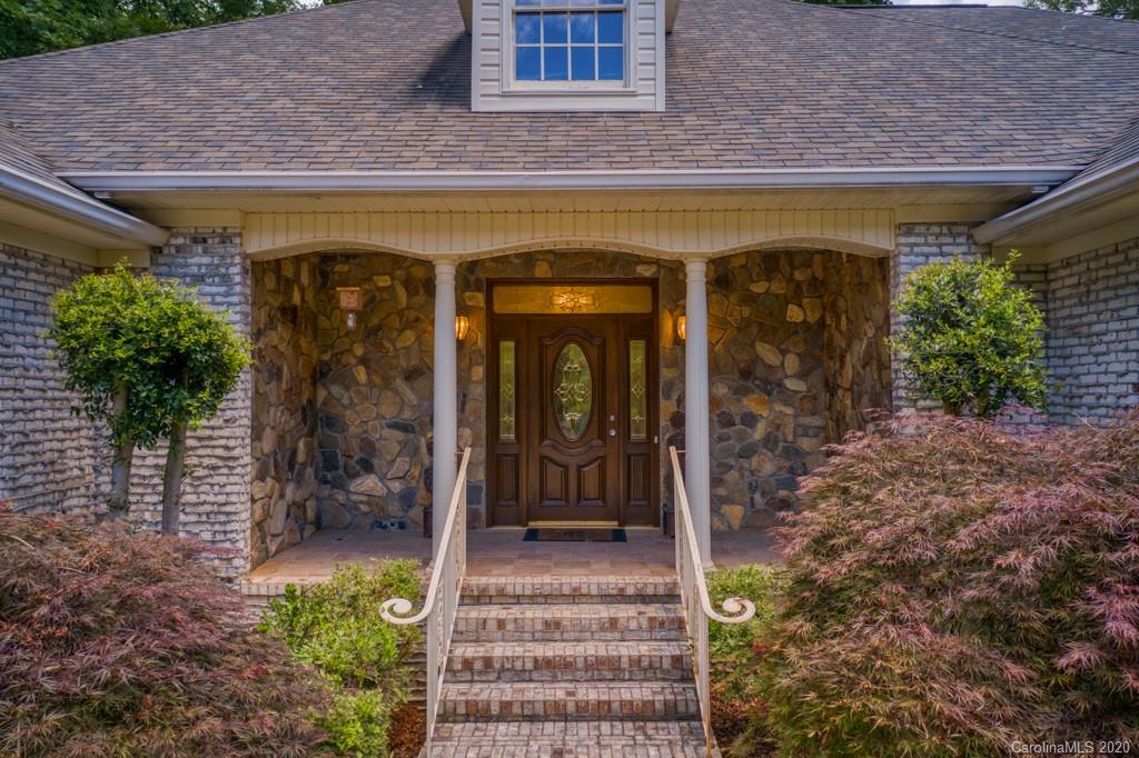77 Club Road Tryon, NC 28782 - Photo 9 of 35 a view of a entryway door front of house