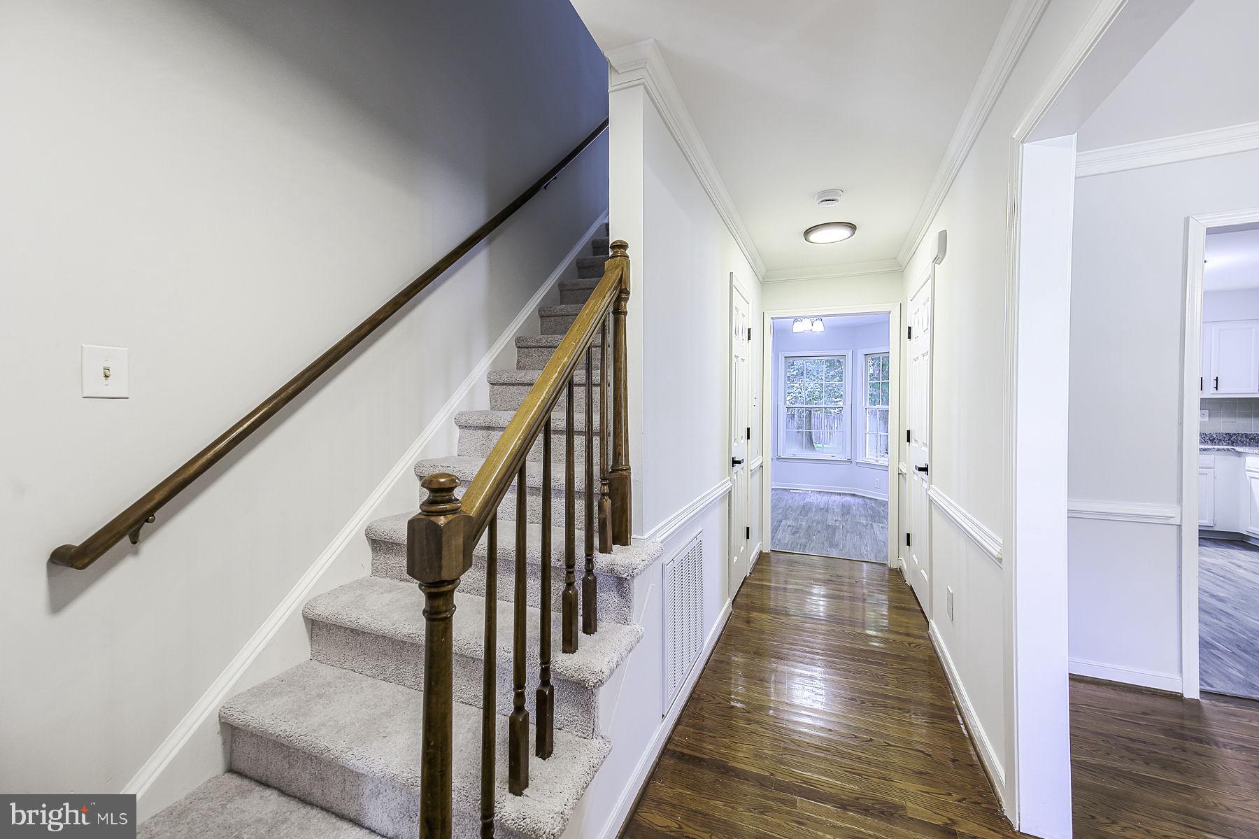 9281 Drawbridge Road Mechanicsville, VA 23116 - Photo 5 of 43 Inviting hallway with elegant staircase.