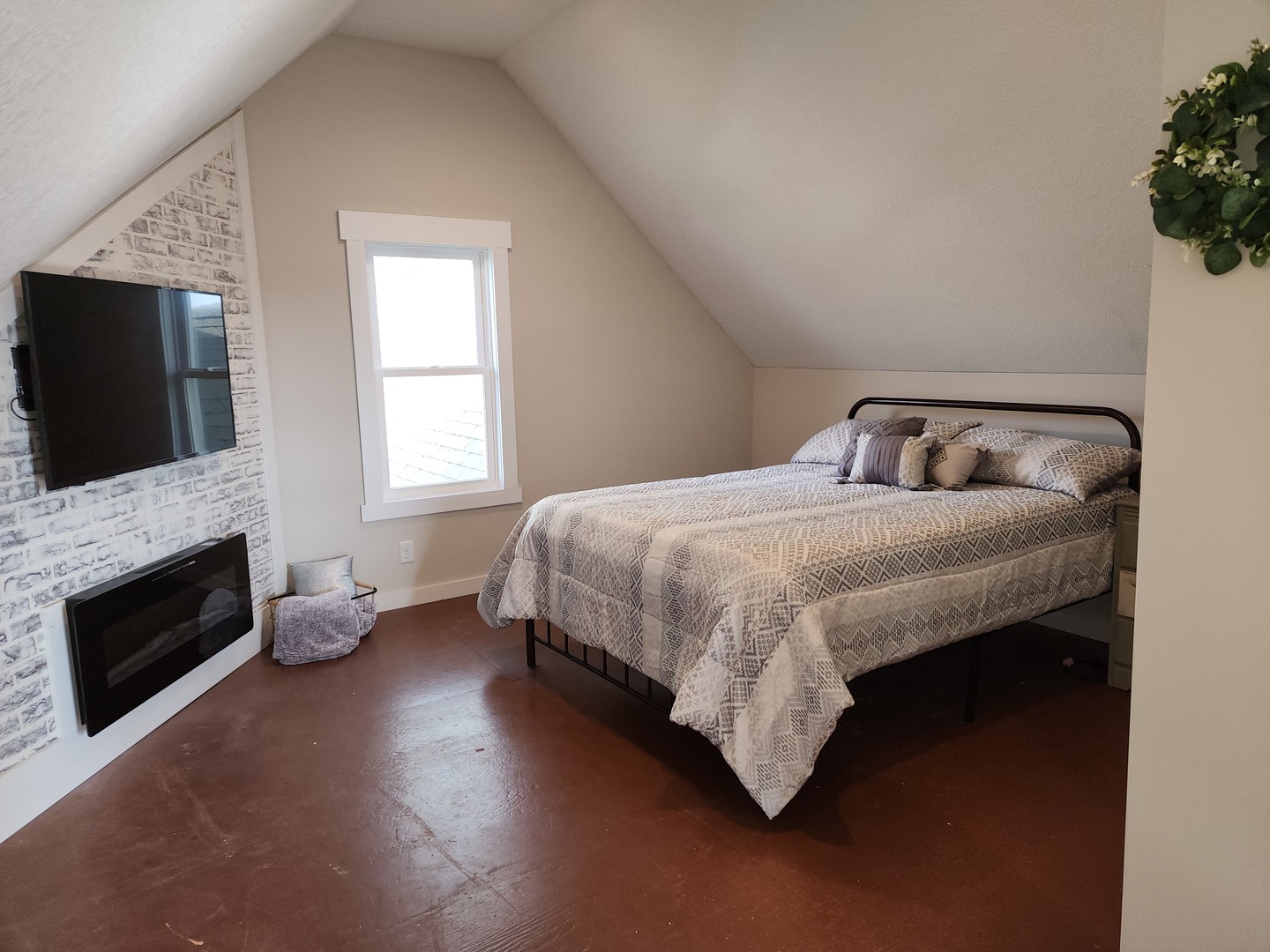 6522 East 3500S Road St. Anne, IL 60964 - Photo 13 of 20 a bedroom with a bed a fireplace and flat screen tv