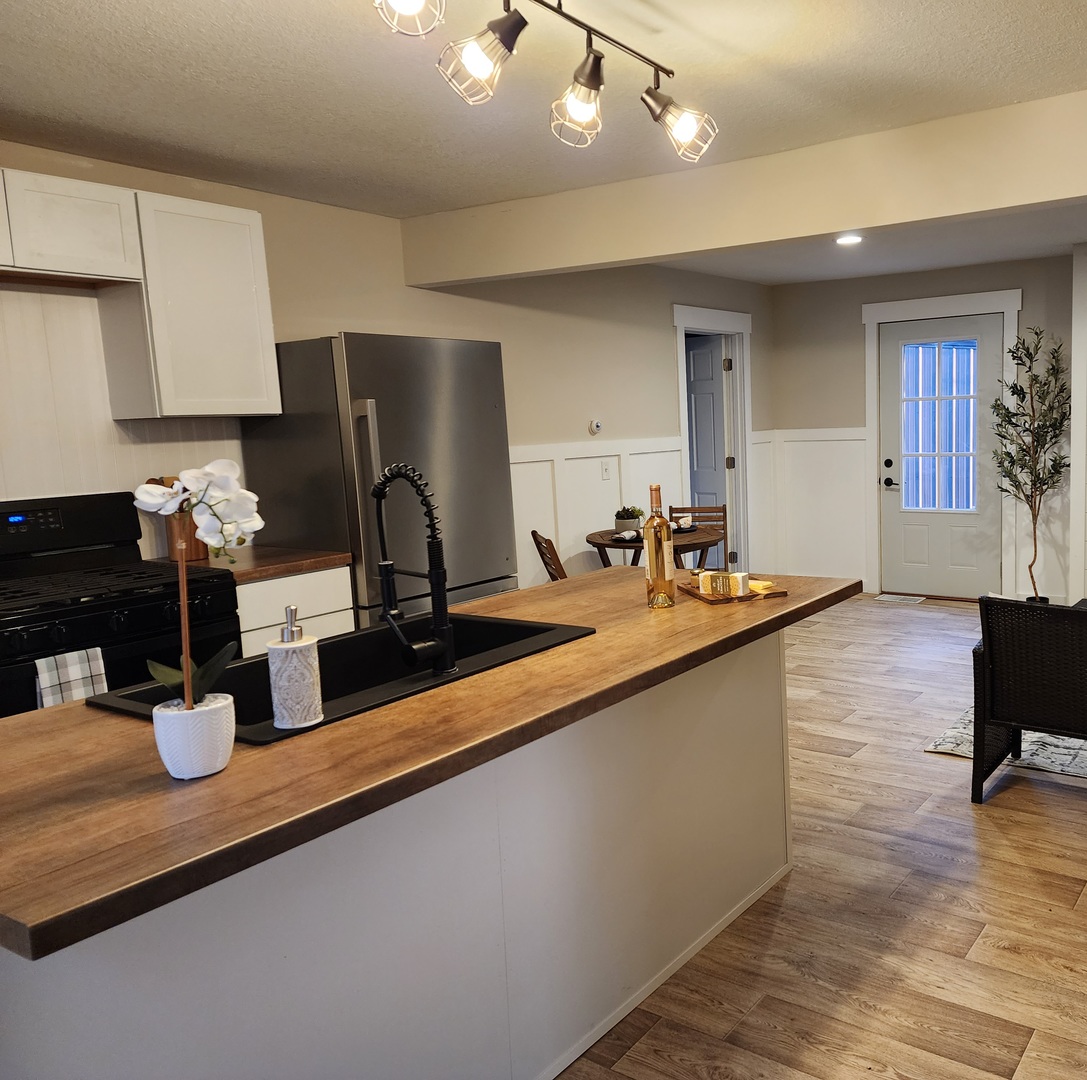 6522 East 3500S Road St. Anne, IL 60964 - Photo 3 of 20 a kitchen with sink and view of living room