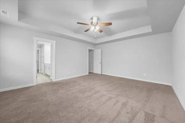 a spacious bathroom with a shower and a sink