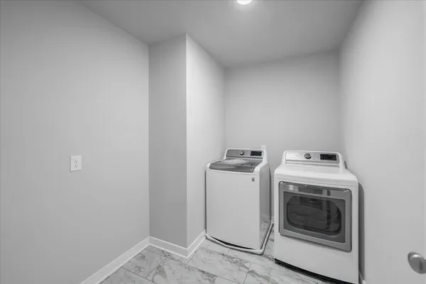 a bathroom with a double vanity sink toilet mirror and bathtub