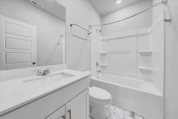 a bathroom with a sink a toilet and a bathtub