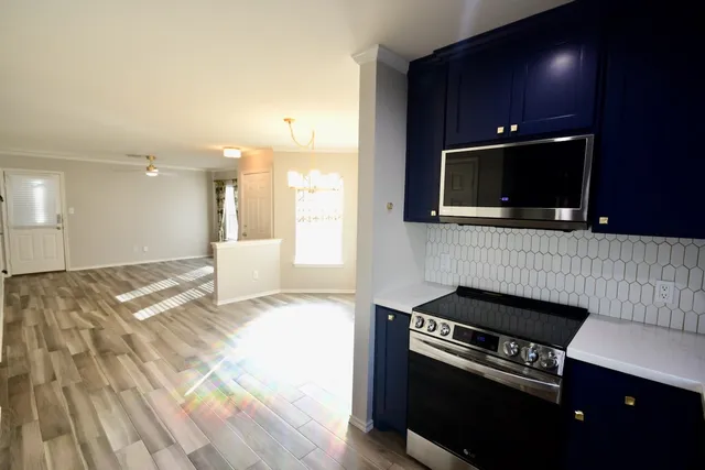 a kitchen with a stove and a microwave