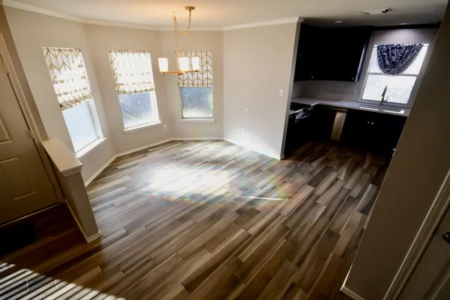 a view of a dining room with furniture window and wooden floor