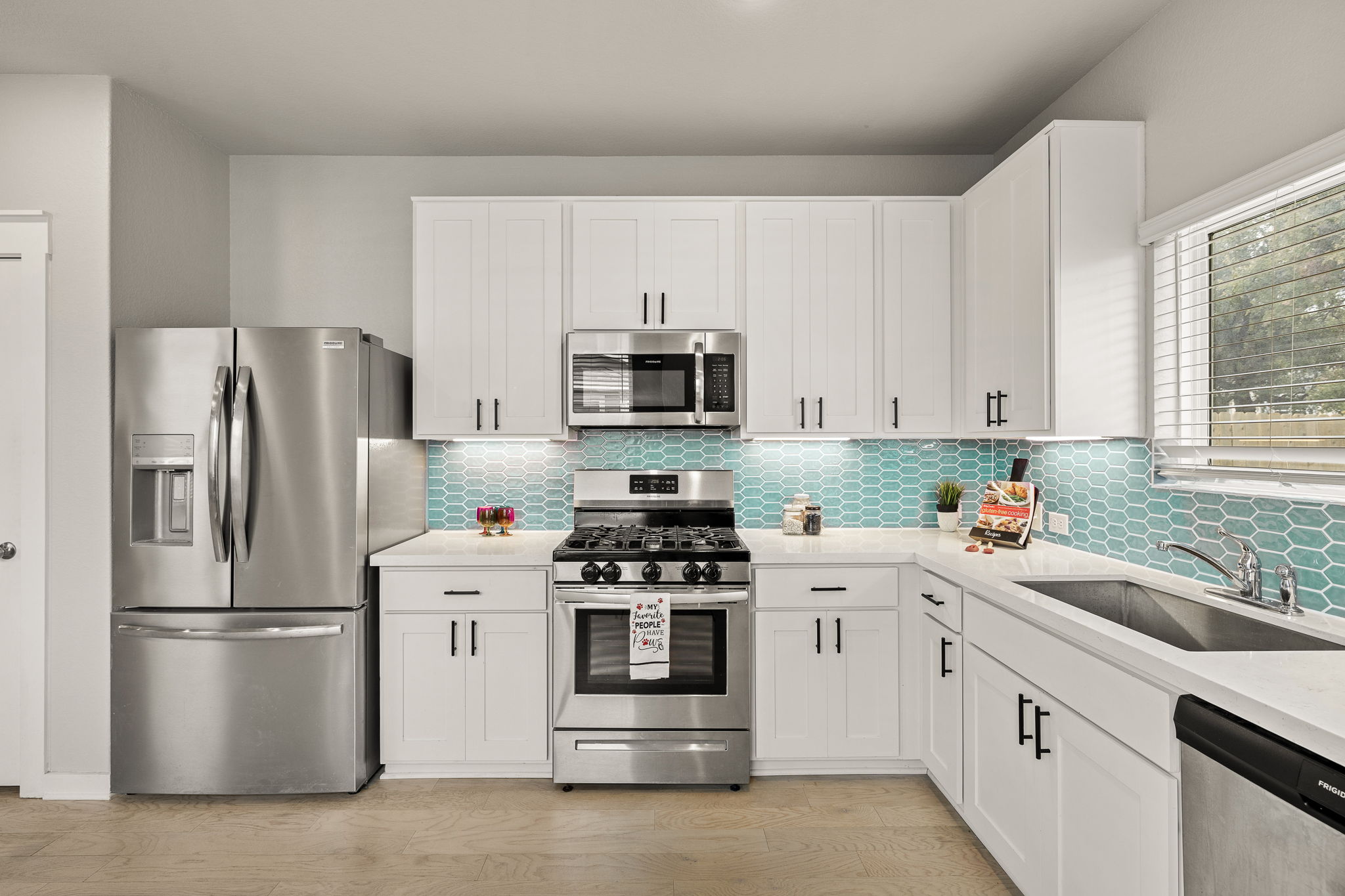 2233 Calvert Drive Leander, TX 78641 - Photo 8 of 32 Quartz counters elevate the design.