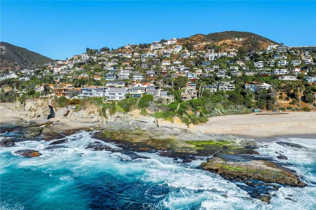 a view of a large building with mountains in the background