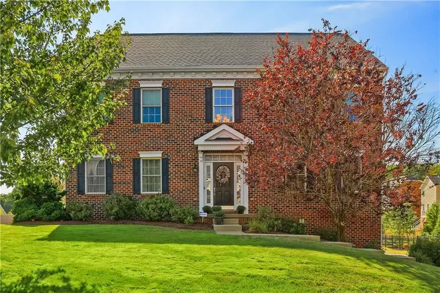 front view of a house with a yard