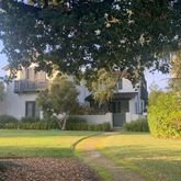 a house with trees in the background
