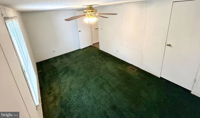 a view of a hallway with a closet