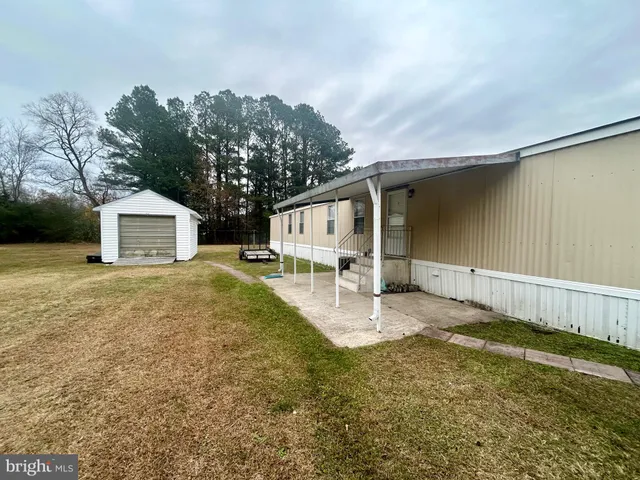 a house view with a backyard space