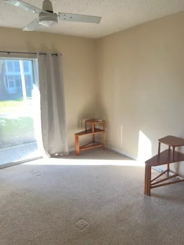 a room with a dresser and a window