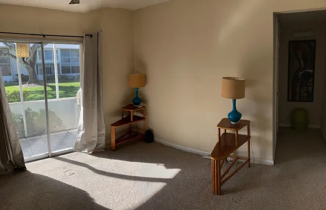 a view of empty room with windows