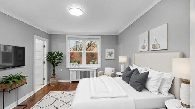 a view of walk in closet with wooden floor