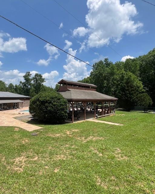 133 Adair Drive Ranger, GA 30734 - Photo 10 of 13 a view of a house with a big yard and a large tree
