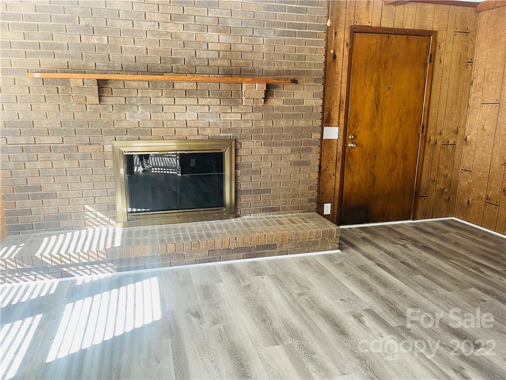 160 Bayleaf Drive Salisbury, NC 28146 - Photo 11 of 27 a view of empty room with wooden floor and fireplace
