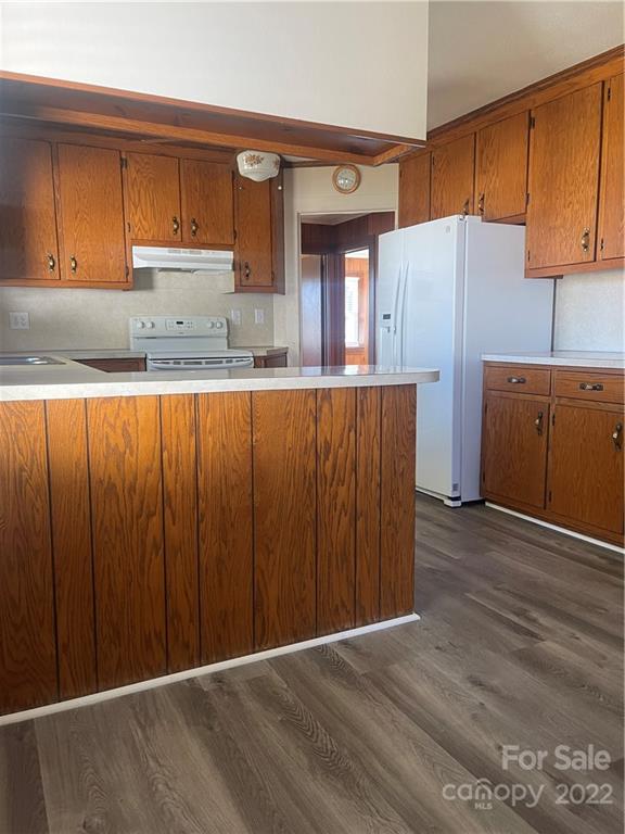 160 Bayleaf Drive Salisbury, NC 28146 - Photo 15 of 27 a kitchen with wooden cabinets and refrigerator