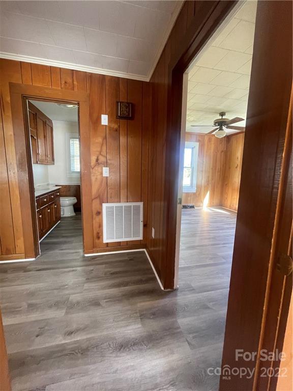 160 Bayleaf Drive Salisbury, NC 28146 - Photo 16 of 27 a view of a hallway with wooden floor and furniture
