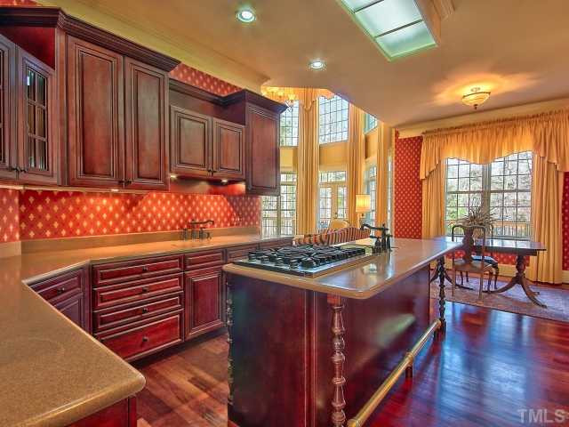14412 Possum Track Road Raleigh, NC 27614 - Photo 6 of 25 Breakfast area with great view. Notice the custom lighting in the kitchen as well. Breakfast Area