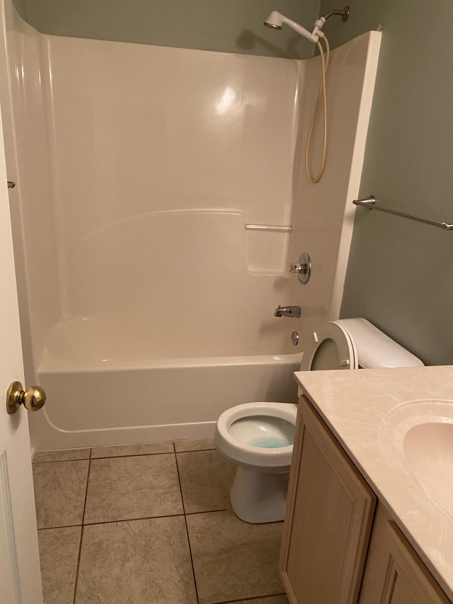 175 Beacon Way Miramar Beach, FL 32550 - Photo 22 of 26 a bathroom with a sink a toilet and shower