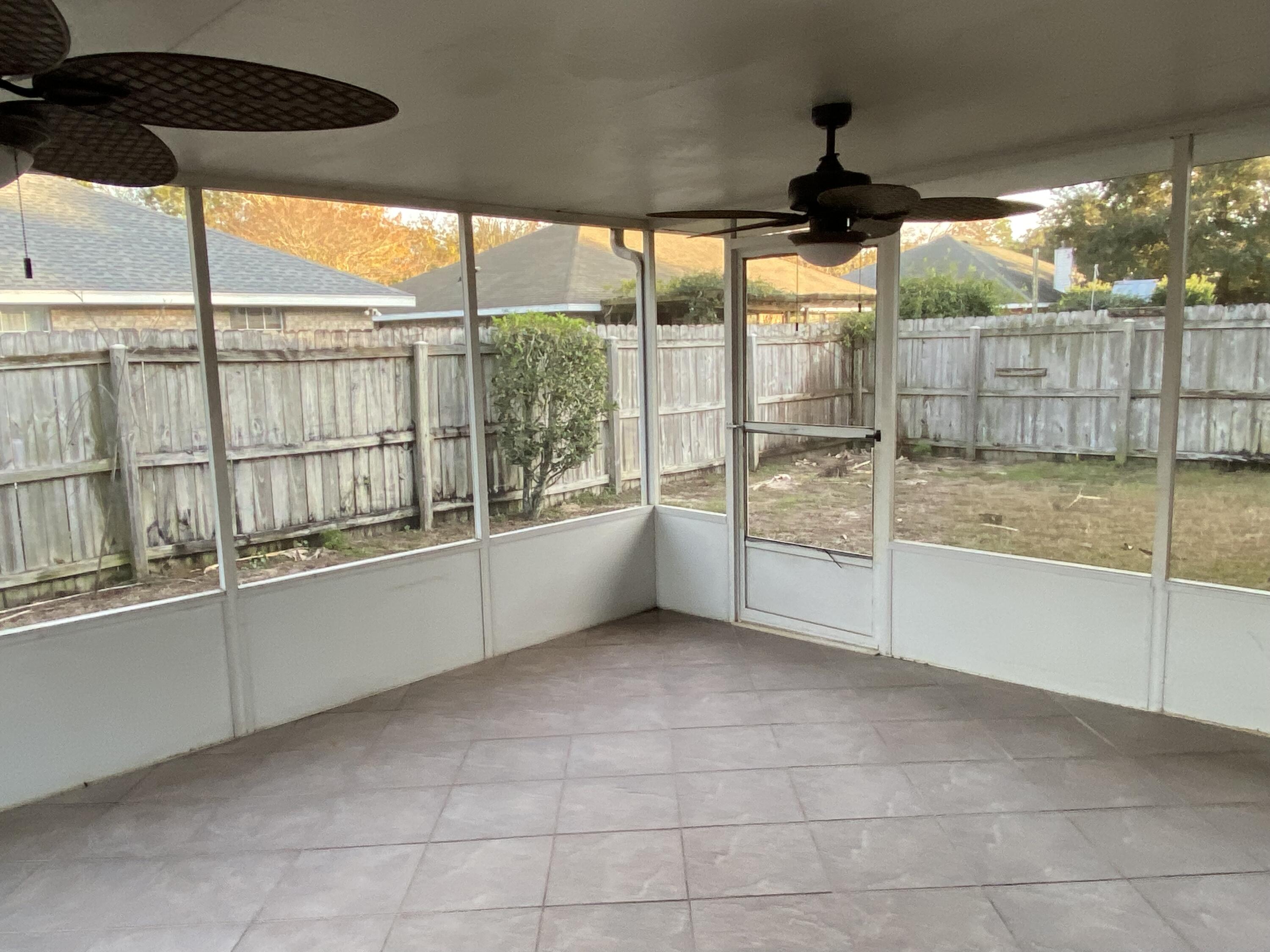 175 Beacon Way Miramar Beach, FL 32550 - Photo 25 of 26 a view of an empty room with a floor to ceiling window and an outdoor view