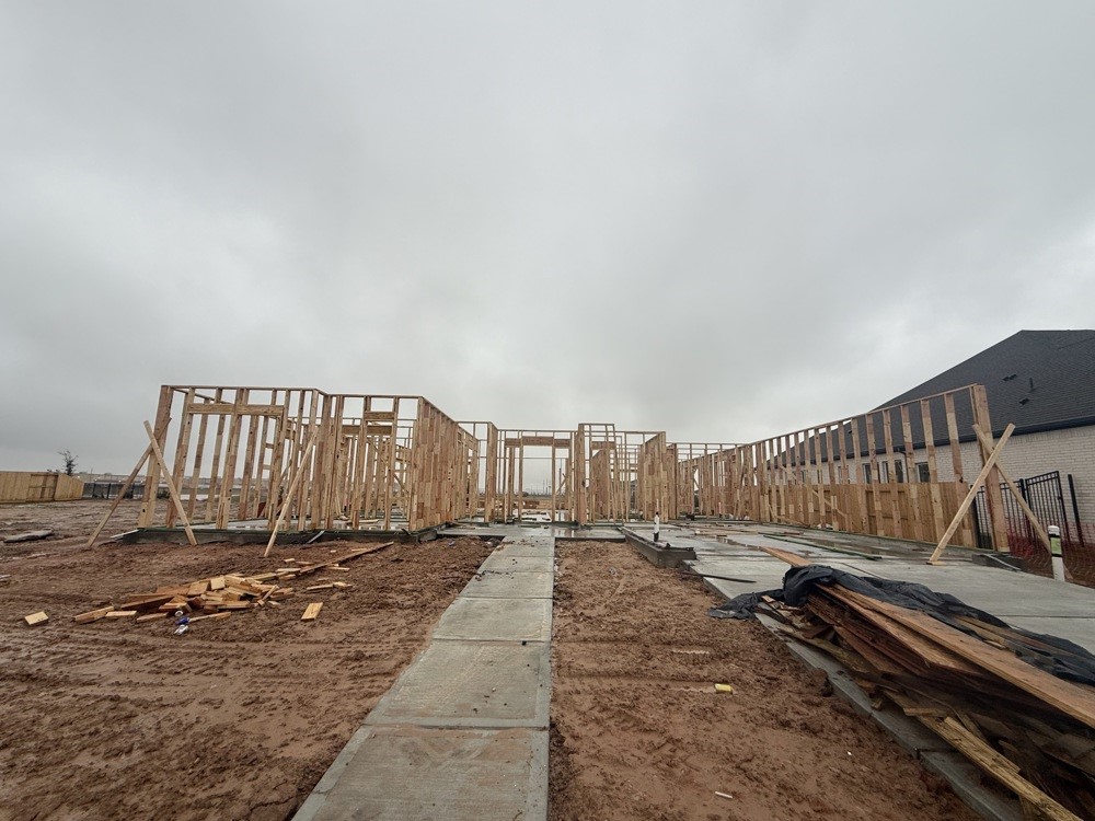 31430 Bluebell Avenue Fulshear, TX 77423 - Photo 3 of 11 a view of a street with wooden fence