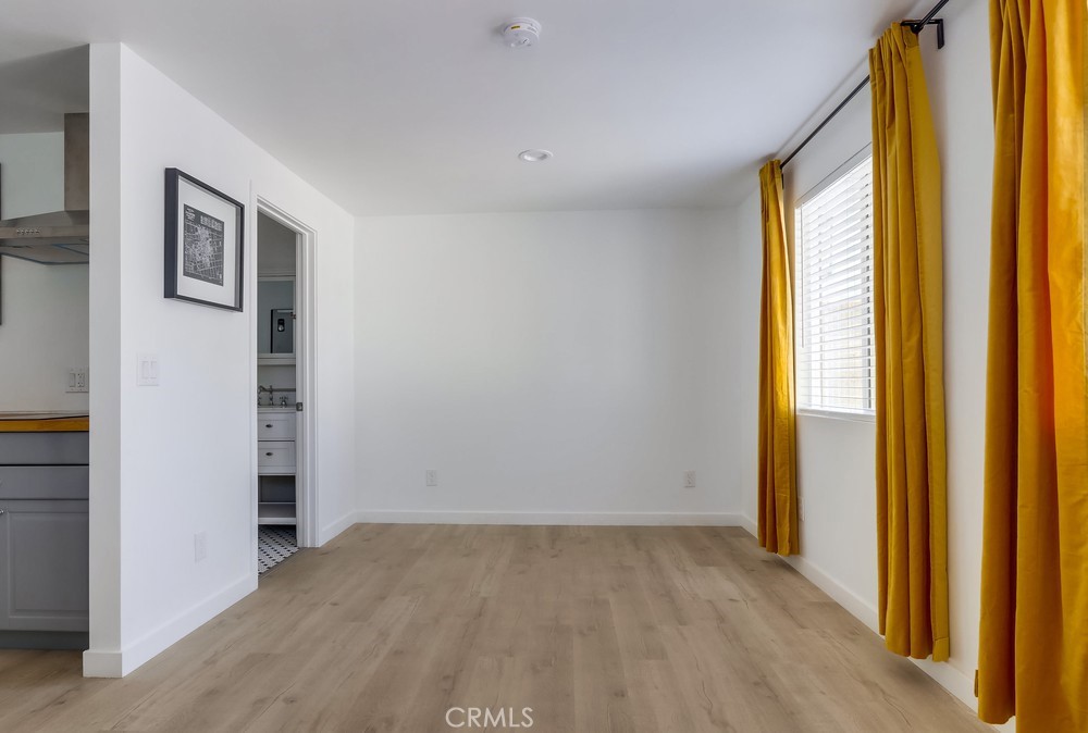 554 South Lemon Street, Unit B Anaheim, CA 92805 - Photo 9 of 10 a view of an empty room with a window