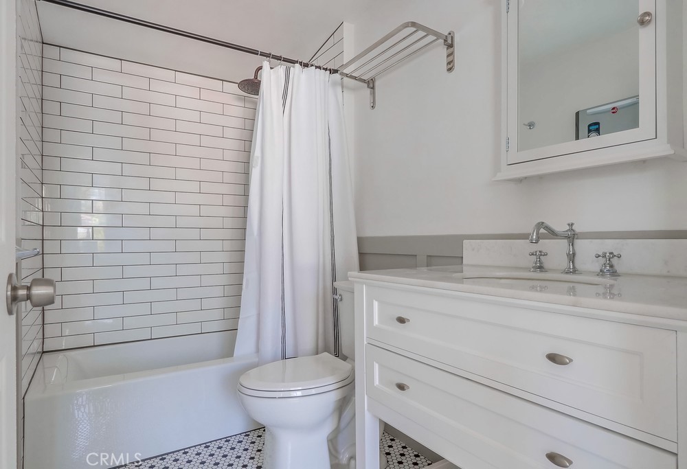 554 South Lemon Street, Unit B Anaheim, CA 92805 - Photo 10 of 10 a bathroom with a shower a toilet and sink