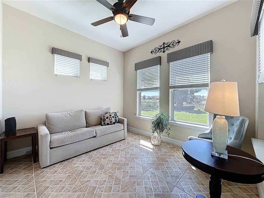 228 Bayou Bend Road Groveland, FL 34736 - Photo 17 of 54 a living room with furniture and a window