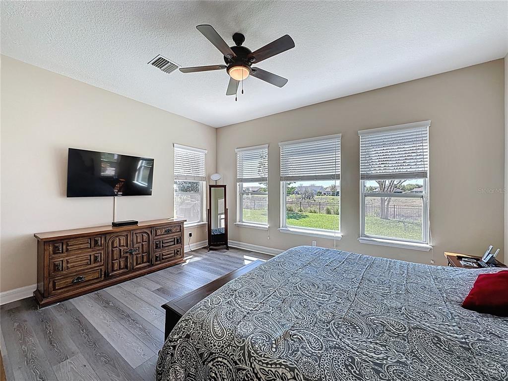 228 Bayou Bend Road Groveland, FL 34736 - Photo 20 of 54 a living room with furniture and a flat screen tv
