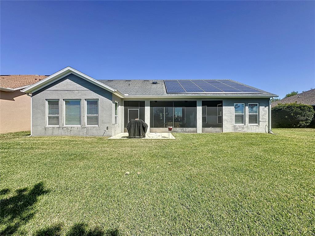 228 Bayou Bend Road Groveland, FL 34736 - Photo 32 of 54 a front view of a house with a garden