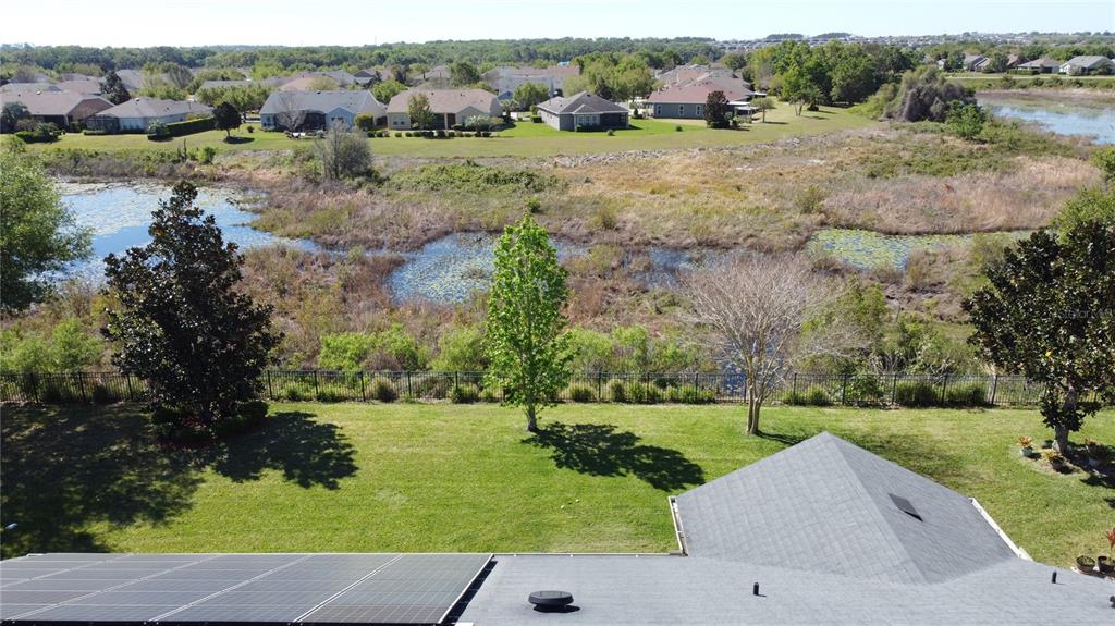 228 Bayou Bend Road Groveland, FL 34736 - Photo 36 of 54 an aerial view of a house with a yard